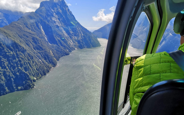 Scenic aerial view from a helicopter of mountains and water