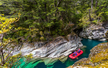 Funyak group floating through the chasms on the Dart River