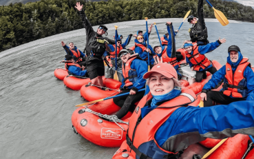 Funyak group and guides smiling in their funyaks on the river