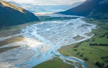 Aerial view of the impressive braided Dart River Valley in Mount Aspiring National Park, surrounded by towering mountains