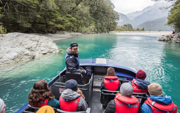 Visitors enjoying Wilderness Jet boat adventure on the Dart River in Mount Aspiring National Park
