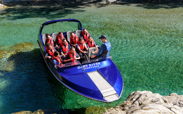 Guide talking to passengers on a Wilderness Jet boat in Glenorchy